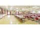 Large event space with rows of tables and chairs, perfect for community gatherings at 5501 80Th N St # 207, St Petersburg, FL 33709