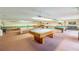 Bright game room with multiple billiard tables for entertaining residents and guests at 5501 80Th N St # 207, St Petersburg, FL 33709