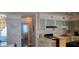 Well-equipped kitchen that connects to the living area with a unique coastal aesthetic at 5501 80Th N St # 207, St Petersburg, FL 33709