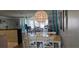 Cozy living room featuring hardwood floors, an ornate light fixture, and ample natural light at 5501 80Th N St # 207, St Petersburg, FL 33709