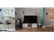 Cozy living room featuring a bar area, golf equipment, and marine-themed decor at 5501 80Th N St # 207, St Petersburg, FL 33709
