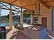 Outdoor community pool with covered grilling area and dining space for relaxation and socializing at 5501 80Th N St # 207, St Petersburg, FL 33709