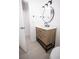 Bathroom with a modern wood vanity, white countertops, and updated fixtures at 5608 Larimer Dr, Tampa, FL 33615
