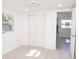 Bright bedroom with a window, sliding closet doors, and a view into another room at 5608 Larimer Dr, Tampa, FL 33615