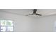 Bright bedroom featuring a ceiling fan, natural light, and neutral color scheme at 5608 Larimer Dr, Tampa, FL 33615