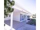 Exterior view of the home featuring the address '5608', covered carport, and tidy landscaping at 5608 Larimer Dr, Tampa, FL 33615