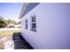 Newly painted exterior features a clean white facade and windows with contrasting blue trim at 5608 Larimer Dr, Tampa, FL 33615