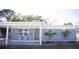 Charming one-story home featuring a brick facade, covered entrance, and well-maintained landscaping at 5608 Larimer Dr, Tampa, FL 33615