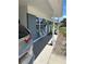 Charming front porch with decorative chairs and blue brick exterior at 5608 Larimer Dr, Tampa, FL 33615