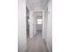 Bright hallway with white doors and tile flooring, creating a clean, modern aesthetic at 5608 Larimer Dr, Tampa, FL 33615