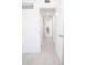 Hallway featuring white walls, modern flooring and views to other rooms at 5608 Larimer Dr, Tampa, FL 33615