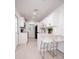 Modern kitchen featuring white cabinets, quartz countertops, black hardware, and stainless steel appliances at 5608 Larimer Dr, Tampa, FL 33615