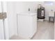Practical laundry area with a utility sink, storage cabinet, and space for a washer/dryer at 5608 Larimer Dr, Tampa, FL 33615