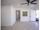 Spacious living room featuring ceramic floors, a ceiling fan, and stylish decor at 5608 Larimer Dr, Tampa, FL 33615
