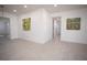 Bright and open living area with light tile and white walls, offering a blank canvas for customization at 5608 Larimer Dr, Tampa, FL 33615