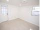 Bright room with a window and an exterior door and white walls at 5608 Larimer Dr, Tampa, FL 33615