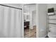 Bathroom featuring shower and vanity with mirrored sliding door closet at 5865 Meadowpark Pl, Lithia, FL 33547
