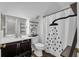 Charming bathroom features vanity with art and shower with modern fixtures at 5865 Meadowpark Pl, Lithia, FL 33547