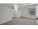 Cozy bedroom features carpeted floors, a ceiling fan, and a bright window at 5865 Meadowpark Pl, Lithia, FL 33547