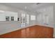 Bonus room featuring hardwood floors, french doors and a separate door at 5865 Meadowpark Pl, Lithia, FL 33547