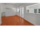Bonus room featuring hard wood floors, french doors and storage cabinets at 5865 Meadowpark Pl, Lithia, FL 33547