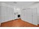 Laundry room featuring hardwood floors, washer/dryer, and storage cabinets at 5865 Meadowpark Pl, Lithia, FL 33547