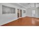 This bright room has hardwood floors and white wainscoting and trim at 5865 Meadowpark Pl, Lithia, FL 33547