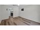 Spacious main bedroom featuring hardwood flooring and a private ensuite bathroom at 5865 Meadowpark Pl, Lithia, FL 33547