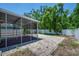 Outdoor patio includes both screened-in and open areas with brick and tile flooring at 5865 Meadowpark Pl, Lithia, FL 33547