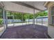 Enjoy the outdoors on this screened-in patio with brick flooring at 5865 Meadowpark Pl, Lithia, FL 33547