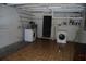 Basement laundry area equipped with washer and dryer hookups and storage space at 6326 55Th N Ave, St Petersburg, FL 33709
