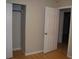 Bedroom with an open closet, and a door for easy access at 6326 55Th N Ave, St Petersburg, FL 33709