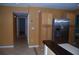 An open kitchen flows into an adjacent hallway, highlighted by stainless steel appliances and ample storage at 6326 55Th N Ave, St Petersburg, FL 33709