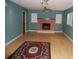 A spacious living area with laminate floors provides a cozy atmosphere, complete with a fireplace at 6326 55Th N Ave, St Petersburg, FL 33709