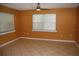 Bright living area with tile flooring, neutral walls, and ample natural light at 6326 55Th N Ave, St Petersburg, FL 33709