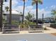 Inviting community benches surrounded by lush landscaping and palm trees at 742 8Th Nw St, Ruskin, FL 33570