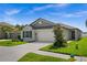 Charming single-story home with a two-car garage, well-manicured lawn and pretty landscaping at 742 8Th Nw St, Ruskin, FL 33570