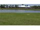 Community clubhouse situated alongside a serene pond and green space at 742 8Th Nw St, Ruskin, FL 33570