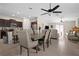 Open concept living space with kitchen, dining area, and living room with tile floors throughout at 742 8Th Nw St, Ruskin, FL 33570