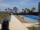 Community pickleball court surrounded by landscaping and palm trees at 742 8Th Nw St, Ruskin, FL 33570