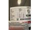 Close-up view of the electric water heater specifications and details on the label at 8317 N Marks St # A, Tampa, FL 33604