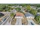 Charming single-Gathering home boasts a well-manicured lawn, a driveway, and a welcoming facade in a serene setting at 8317 N Marks St, Tampa, FL 33604