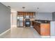 View of the kitchen with stainless steel appliances and wooden cabinets at 8317 N Marks St, Tampa, FL 33604