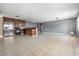 Open-concept kitchen with tile flooring and stainless steel appliances at 8317 N Marks St, Tampa, FL 33604