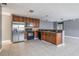 Kitchen with stainless steel appliances, and wood cabinets at 8317 N Marks St, Tampa, FL 33604