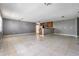 Open living area featuring light tile flooring and ample natural light at 8317 N Marks St, Tampa, FL 33604