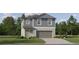 Charming two-story home featuring a two-car garage, neutral siding, and a well-manicured front lawn at 8518 Sea Ray Run, Parrish, FL 34219