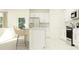 Bright, modern kitchen with stainless steel appliances and breakfast bar seating at 8518 Sea Ray Run, Parrish, FL 34219