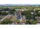 Aerial view of neighborhood with mature trees, brick streets and view of the Tampa skyline at 905 W Fribley St, Tampa, FL 33603