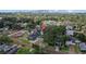 Aerial view of quiet neighborhood with mature trees, brick streets and Tampa skyline views at 905 W Fribley St, Tampa, FL 33603